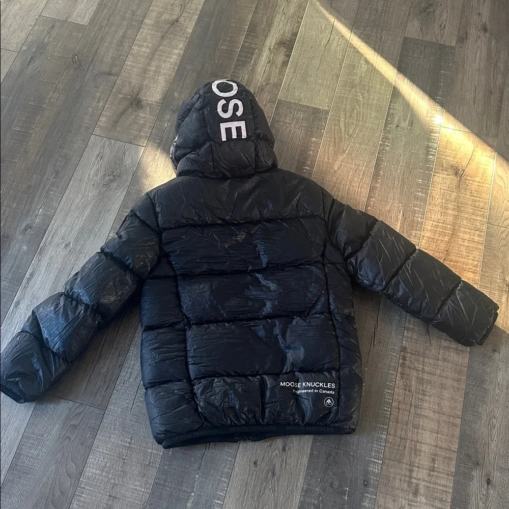 Moose Knuckles black hooded puffer with hologram imprint logo size small